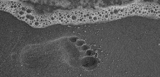barefoot print in sand